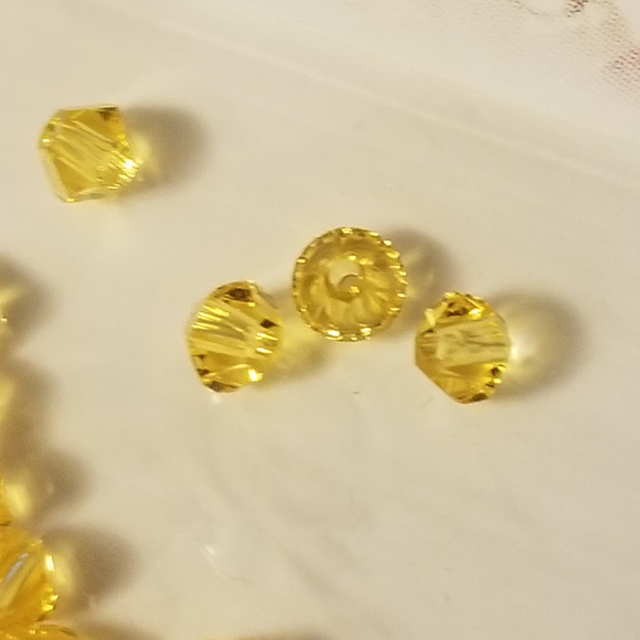 4/$75 Swarovski 3mm Bi-cone Light Topaz Crystals - Picture 3 of 3